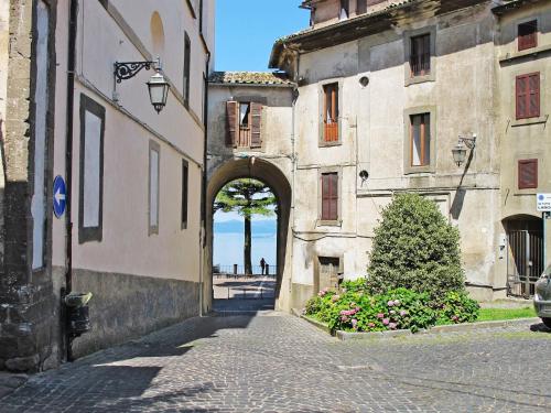 an alley in an old building with an arch in the middle at Holiday Home Casale Vitello by Interhome in Proceno