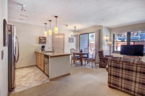 a kitchen and living room with a sink and a refrigerator at Standard Apartment in Breckenridge
