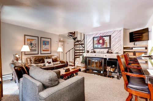 a living room with a couch and a fireplace at Flying Dutchman 1124 in Keystone