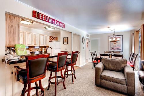 a kitchen and a living room with a table and chairs at Flying Dutchman 1124 in Keystone