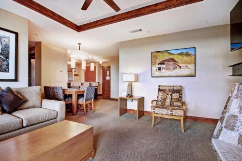 a living room with a couch and a table at One Ski Hill Place S8412 in Breckenridge