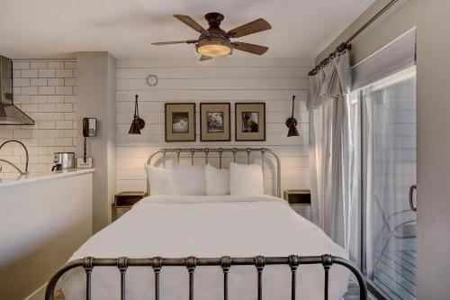 a bedroom with a bed with a ceiling fan at River Mtn Lodge W301 in Breckenridge