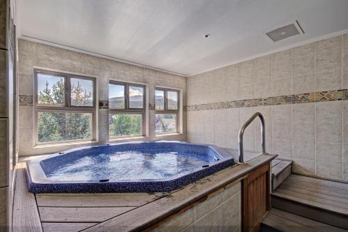 a large bathroom with a large blue tub at River Mtn Lodge W301 in Breckenridge