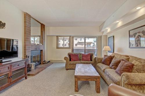 a living room with a couch and a tv at VAB Antero 1205 in Breckenridge