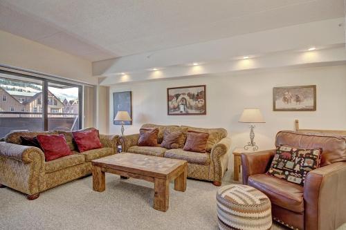 a living room with two couches and a coffee table at VAB Antero 1205 in Breckenridge