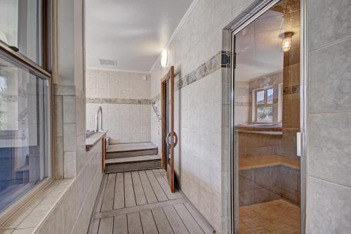 a bathroom with a walk in shower next to a toilet at River Mtn Lodge E301 in Breckenridge