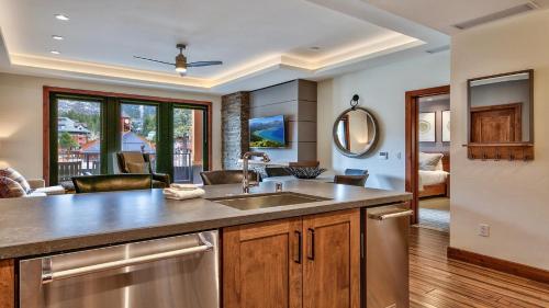 a kitchen with a sink and a living room at Zalanta 221 in South Lake Tahoe