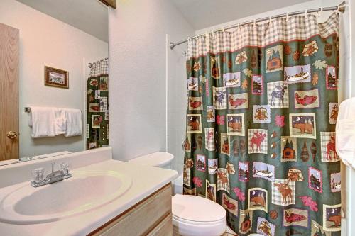 a bathroom with a sink and a shower curtain at River Mtn Lodge W219 in Breckenridge
