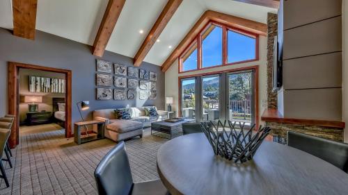 a living room with a table and a couch at Luxury 2Br Residence Steps From Heavenly Village & Gondola Condo in South Lake Tahoe