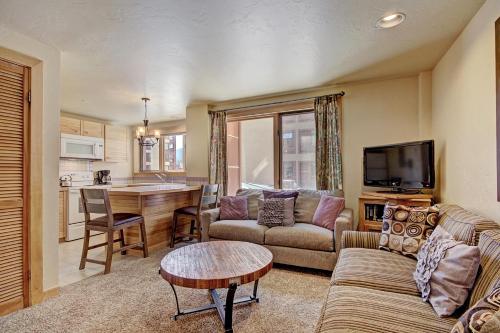 a living room with a couch and a table at Village at Breck V4224 in Breckenridge
