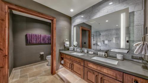 a bathroom with two sinks and a large mirror at Luxury 3Br Residence Steps From Heavenly Village & Gondola Condo in South Lake Tahoe