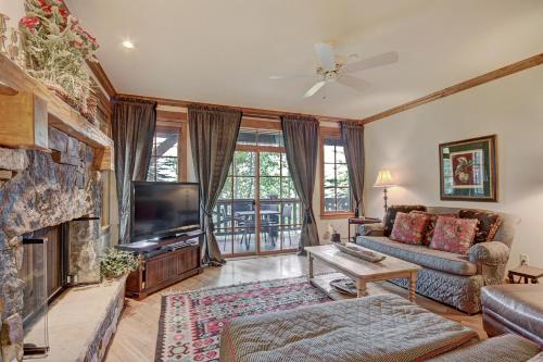 a living room with a couch and a television at Settler's Lodge 204 in Edwards