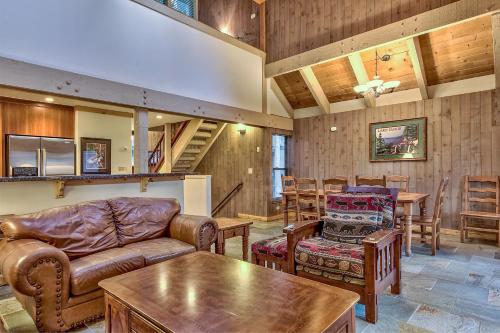a living room with leather furniture and a table at 511 Pine Grove in South Lake Tahoe