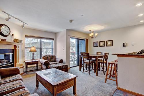 a living room with a table and a dining room at Two-Bedroom Apartment in Breckenridge