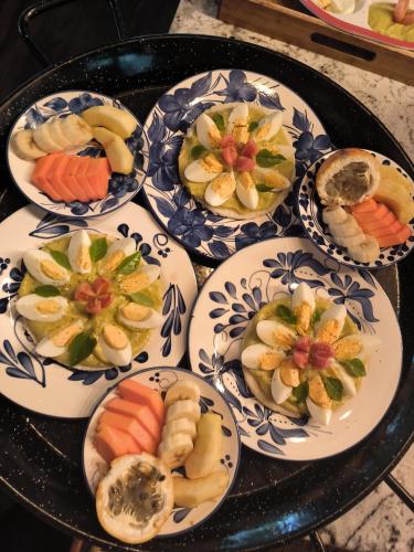 a group of plates of food on a table at Salvia Madre Hotel Boutique in Guachaca