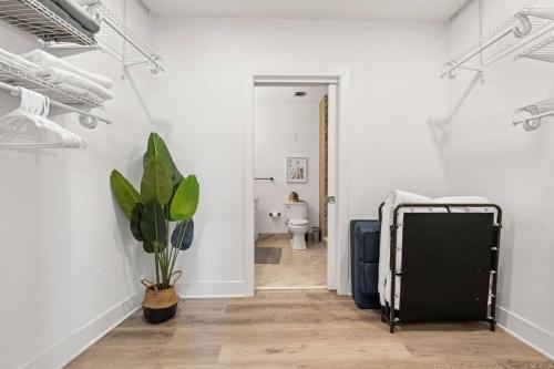 a hallway with a toilet in a white room at Entire Apt/2bd 2bth/Amer. Dream Mall/Nyc/EWR Airpt in Newark