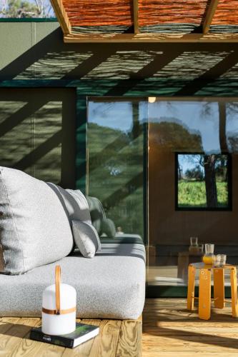 a living room with a couch and a table at wecamp Santa Cristina in Santa Cristina d'Aro