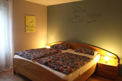 a bedroom with a bed with two pillows on it at Twistesee Ferienwohnung in Bad Arolsen