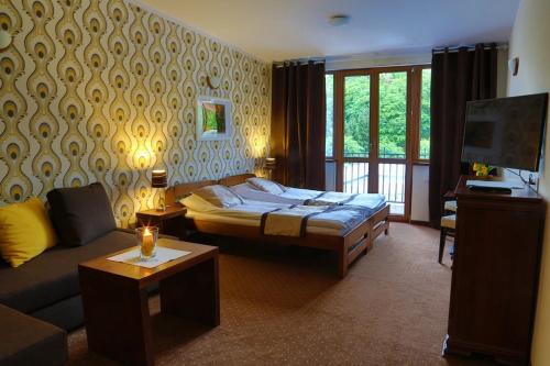 Postel nebo postele na pokoji v ubytování Pod Wzgórzem Bed & Breakfast