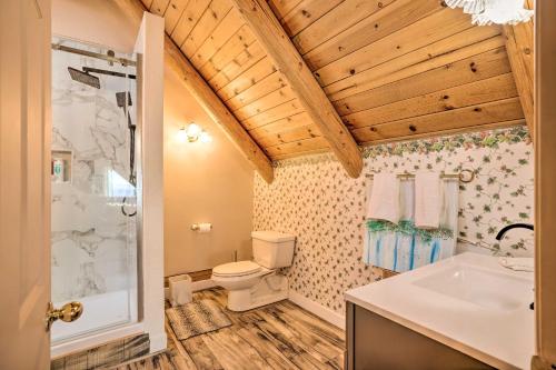 a bathroom with a toilet and a shower and a sink at Mountain Bliss Chalet with Great Views! in Sonora