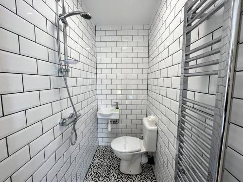 a bathroom with a toilet and a sink at Flat 14, 10 St John’s in Bournemouth