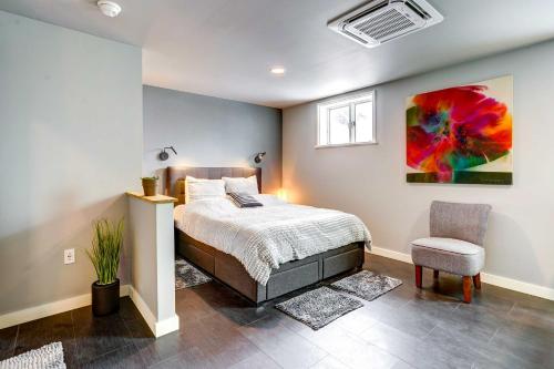 1 dormitorio con 1 cama y 1 silla en Pet-Friendly Dryden Vacation Rental!, 