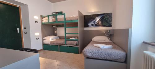 a small room with two bunk beds in it at Ostello Giovane Europa di Trento in Trento