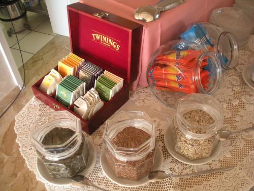 a table with three containers of food and a box at Hotel Garni Villa del Sole in Ponte Tresa
