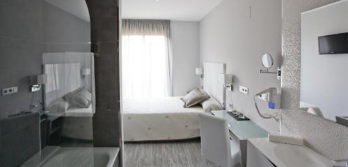Posteľ alebo postele v izbe v ubytovaní Alix Boutique