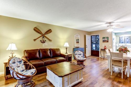 a living room with a couch and a table at 8A Amelia Landings Condo in Fernandina Beach