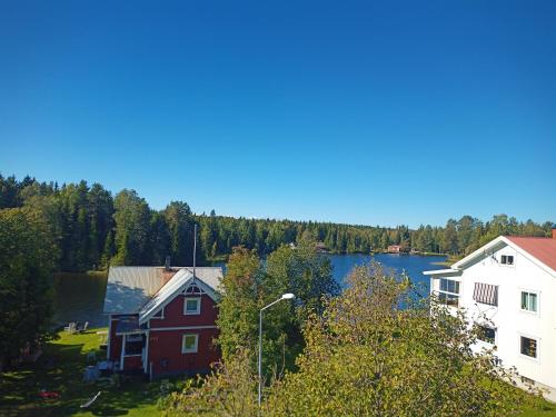 a view of a house and a lake at Exklusiv flat with office 25 min from Östersund in Ytterån
