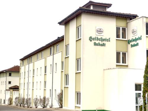 a large white building with the words sterilized apartments at Heidehotel Lubast in Lubast
