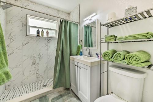a bathroom with a shower toilet and a sink at Bright, Pet-Friendly Retreat in Avon Park! in Avon Park