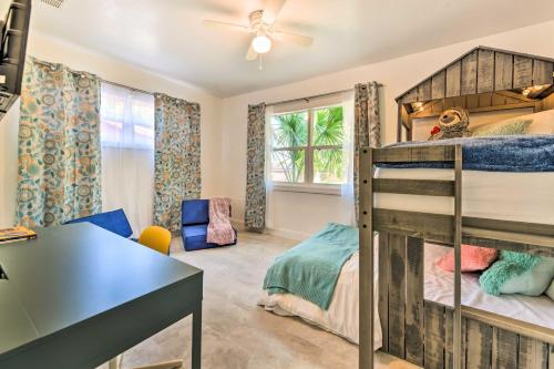 a bedroom with a bunk bed and a desk at Bright, Pet-Friendly Retreat in Avon Park! in Avon Park
