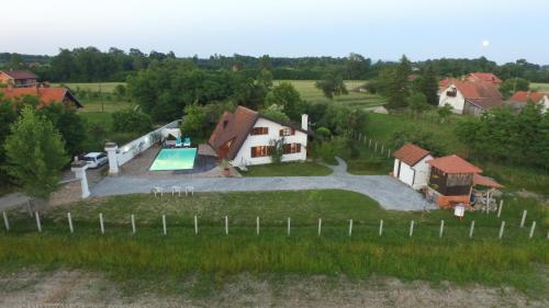 an aerial view of a house with a swimming pool at Vikendica Despotovic in Bijeljina