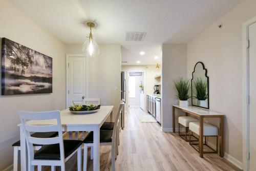 a kitchen and dining room with a table and chairs at Remodeled NO STEPS Citrus Lane Luxury Amazing View in Branson