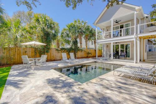 a house with a swimming pool in front of a house at Carolina Boulevard 808 in Isle of Palms