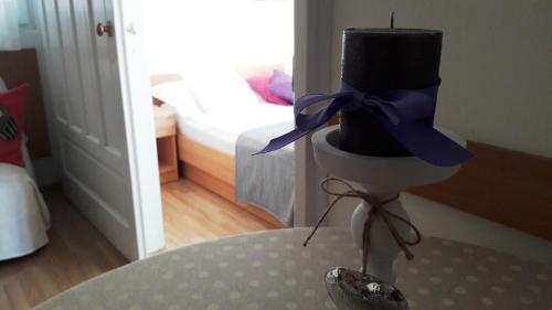 a top hat on top of a table in a room at Apartments Milena & Ante in Makarska