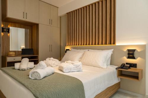 Postel nebo postele na pokoji v ubytování Ruby Luxury Suites