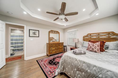 a bedroom with a bed and a ceiling fan at East Point Elegance in Atlanta