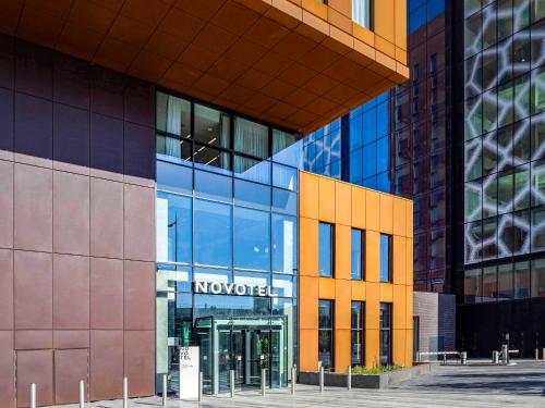 a building with a novo sign on the side of it at Novotel Liverpool Paddington Village in Liverpool