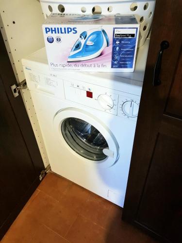 a washing machine with a box on top of it at La Baronessa Country House in Montefiascone