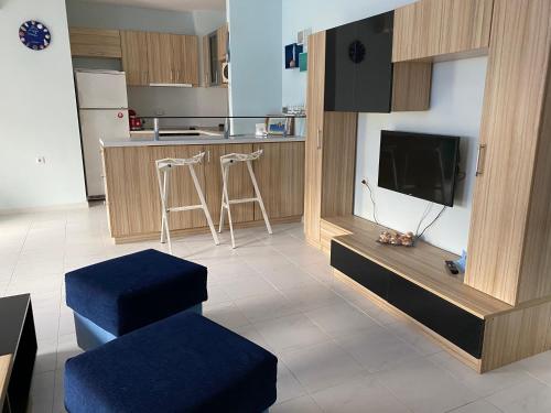 a living room with a tv and a kitchen at Blue Lagoon apartment next to the centre Kranevo. in Kranevo