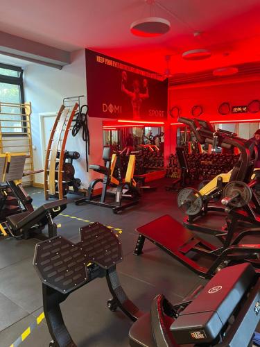 a gym with lots of treadmills and elliptical machines at Apartment Pompei Wellness in Pompei