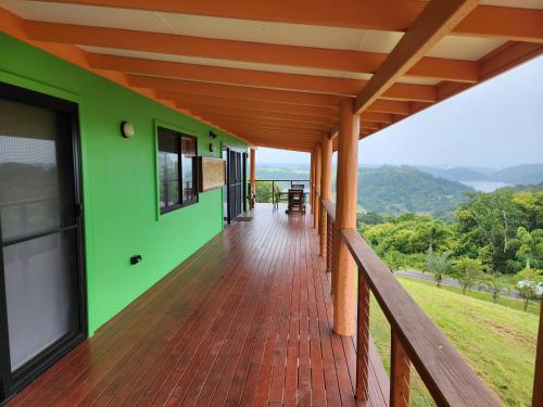 a balcony of a house with a green wall at Maleny Tropical Retreat in Maleny