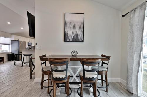 a kitchen and dining room with a table and chairs at Rutland's Hidden Gem- 2 BR 1BA Renovated Home Close to Everything home in Rutland