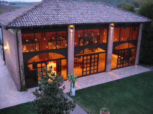an aerial view of a large house with a porch at Agriturismo La Lupa in Madonna della Provvidenza