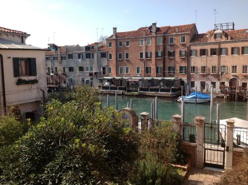 a view of a canal with buildings and boats at Al Redentore Di Venezia in Venice
