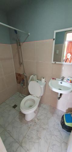 a bathroom with a toilet and a sink at House for Rent Iloilo Arevalo in Iloilo City