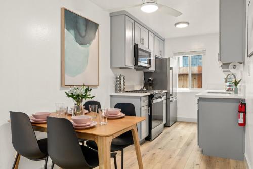 a kitchen and dining room with a table and chairs at Central Apartment in a Hip Walkable Neighborhood NRP23-01143 in Long Beach